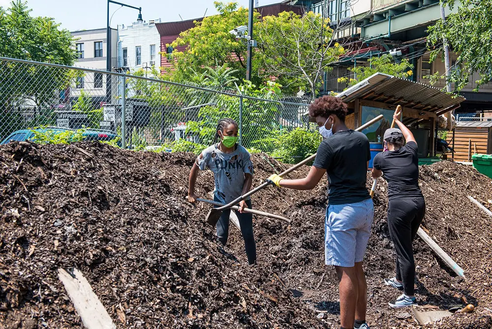 BK ROT members spreading out compost