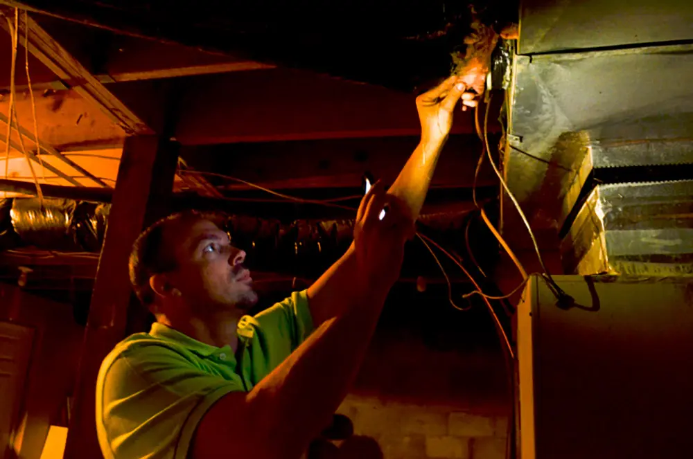 Mountain Association member fixing wires