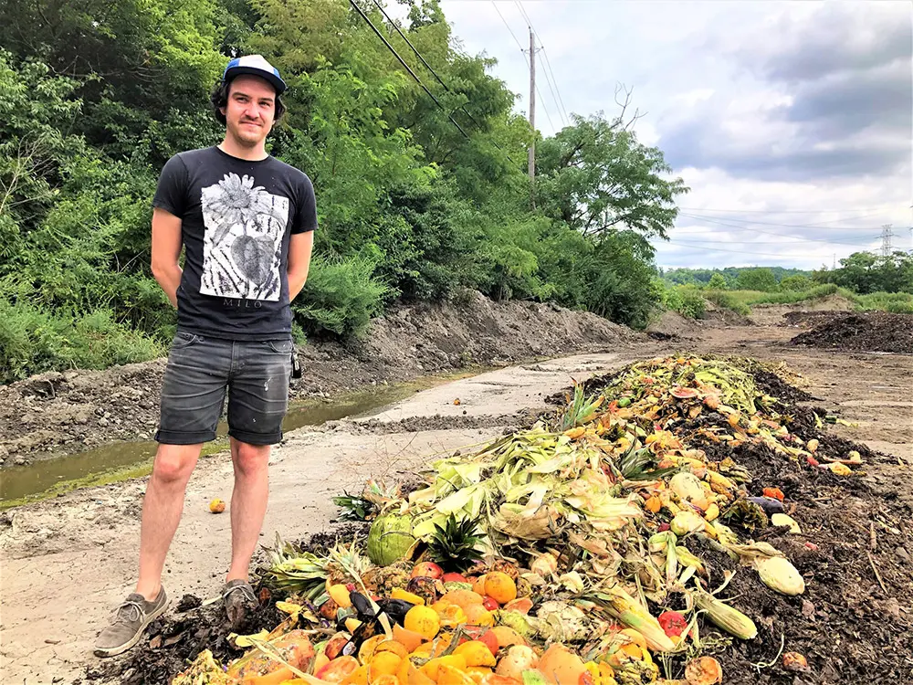 Rust Belt Riders member with produce on the ground