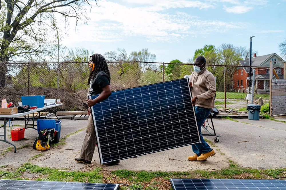 Soulardarity members holding solar panels