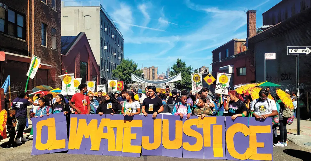 Sunset Park Solar members holding climate justice banner