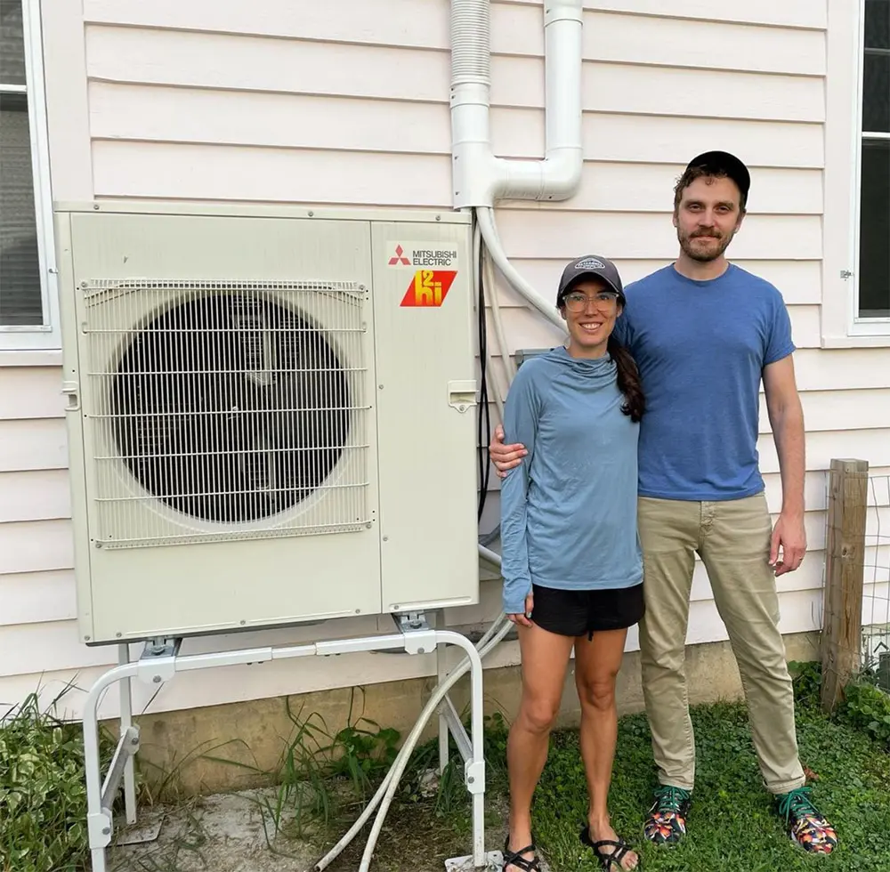 Winneshiek Energy District members in front of a house